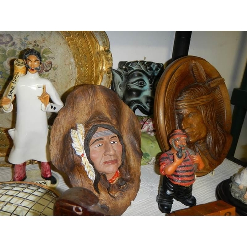 738 - A varied selection of carved wooden items including eagle, soldier, condiment set, totem pole etc.,