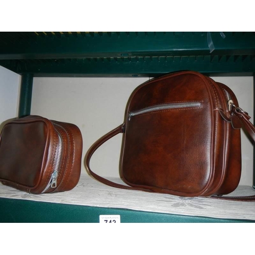 743 - A brown leather shoulder bag and one other.