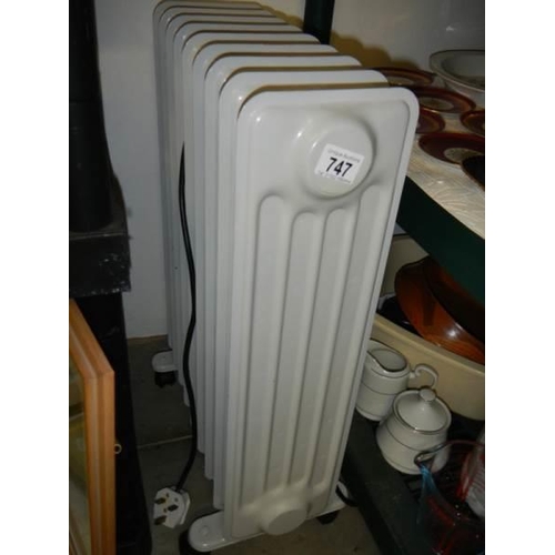 747 - An oil filled radiator. COLLECT ONLY.