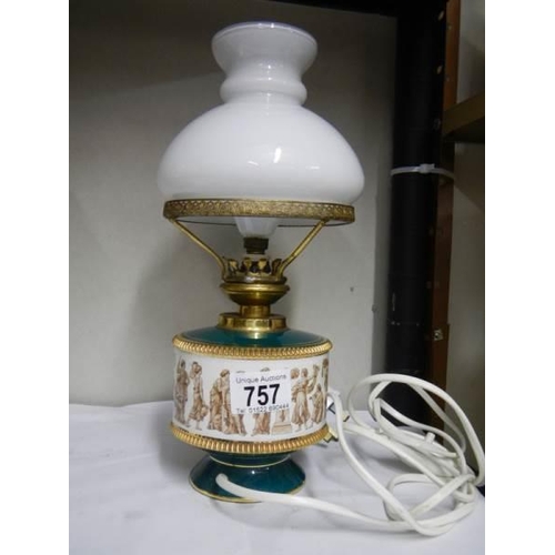 757 - An Italian style ceramic table lamp with glass shade. 30 cm tall.