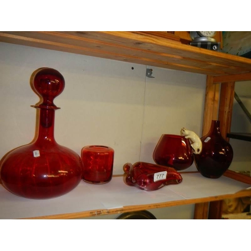 777 - A mixed lot of ruby glass including art glass ashtray, brandy glass with cat and mouse etc.,