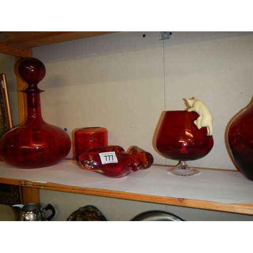 777 - A mixed lot of ruby glass including art glass ashtray, brandy glass with cat and mouse etc.,