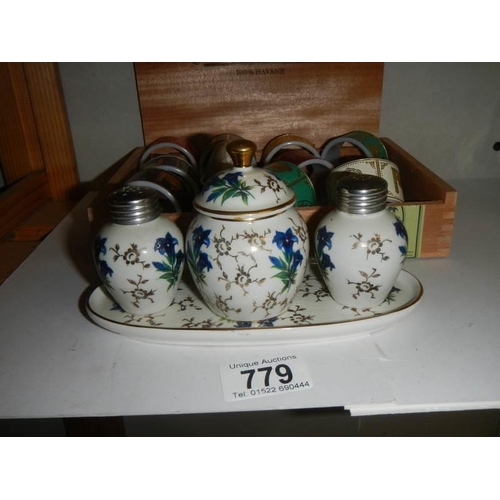 779 - A Bavarian cruet set and plated napkin rings.