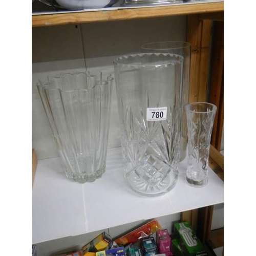 780 - A tall cut glass vase and one other.