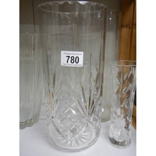 780 - A tall cut glass vase and one other.