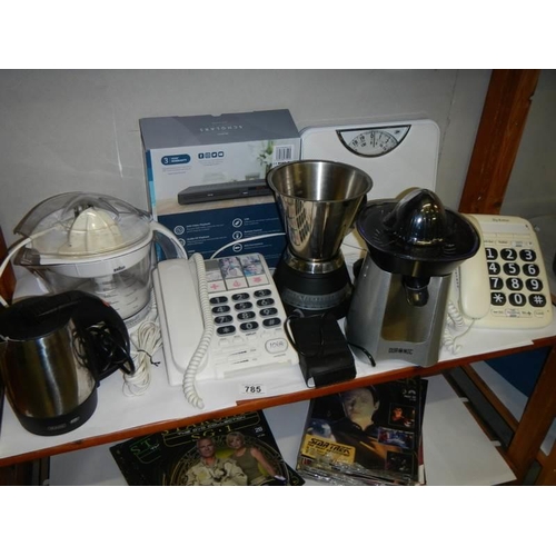 785 - A mixed lot of kitchen utensils including juicer, scales etc.,