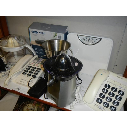 785 - A mixed lot of kitchen utensils including juicer, scales etc.,