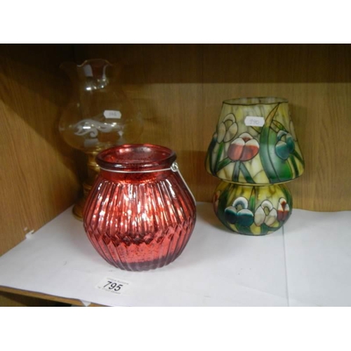 795 - A Tiffany style painted glass tea lamp and two others.