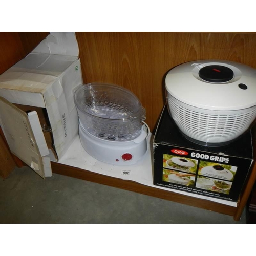 806 - A boxed vegetable steamer and a salad spinner, both look unused.