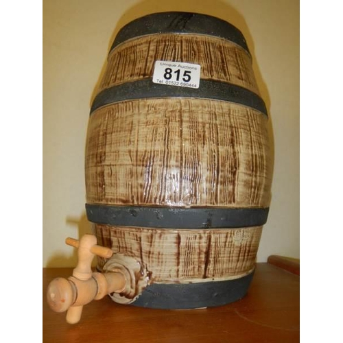 815 - A vintage pottery Taunton cider barrel with wooden tap, 27 cm tall.