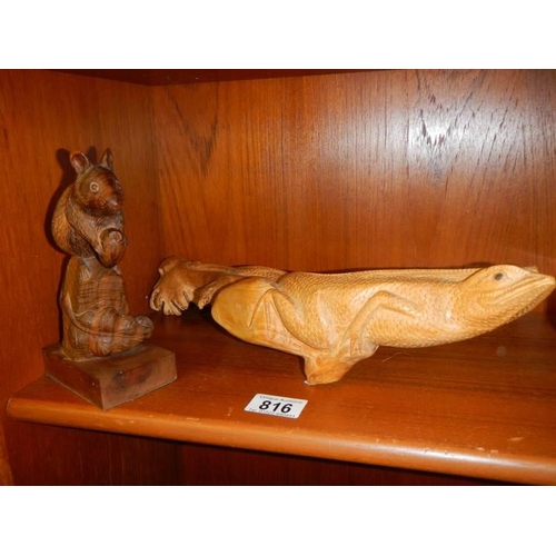 816 - A carved wood lizard and mouse.