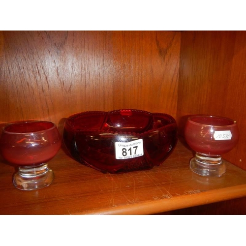 817 - A vintage ruby glass fruit bowl and two footed glasses.