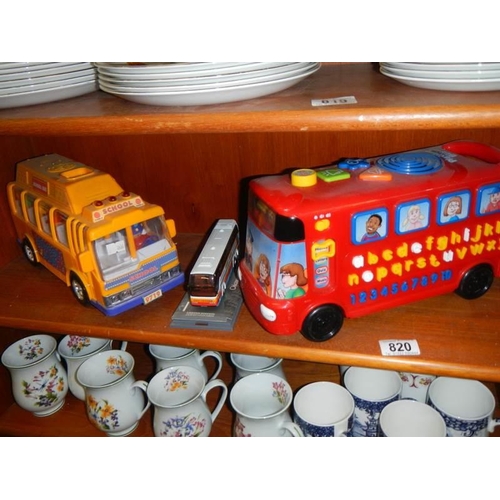 820 - Two toddler's play buses and a limited edition die cast coach.