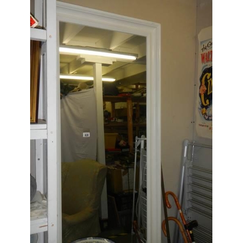 828 - A large white framed mirror. COLLECT ONLY.