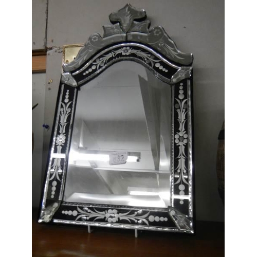 832 - A Venetian style bevel edged and engraved mirror. COLLECT ONLY.