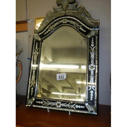 832 - A Venetian style bevel edged and engraved mirror. COLLECT ONLY.