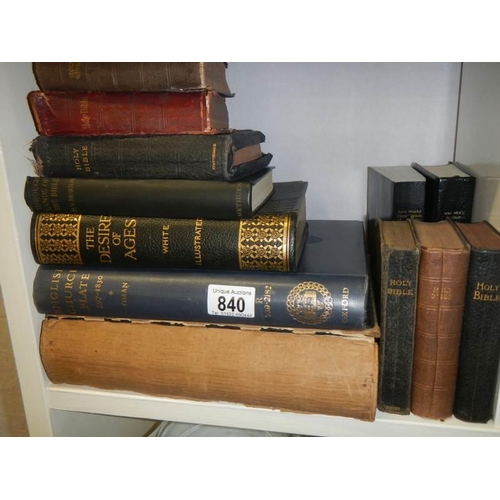 840 - A shelf of old books including Bibles.