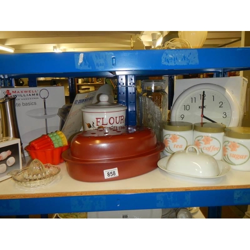 858 - A mixed lot of kitchen ware including storage jars, jelly moulds etc.,