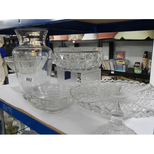 892 - Four glass fruit bowls and a vase.