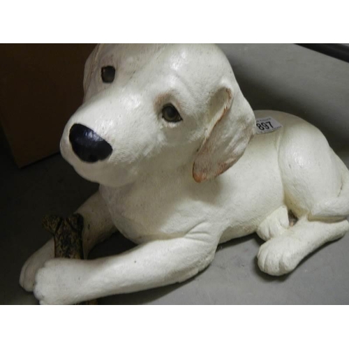 897 - A Labrador puppy garden ornament.