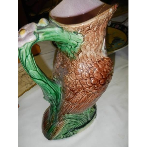 907 - A mid 20th century owl jug in the style of Martin Brothers, chip in top rim.