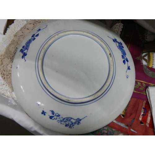 909 - An early 20th century Chinese style blue and white plate.