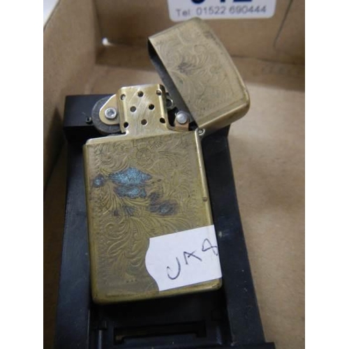 912 - A boxed viintage Zippo lighter.