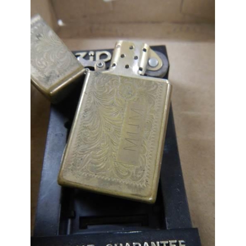 912 - A boxed viintage Zippo lighter.