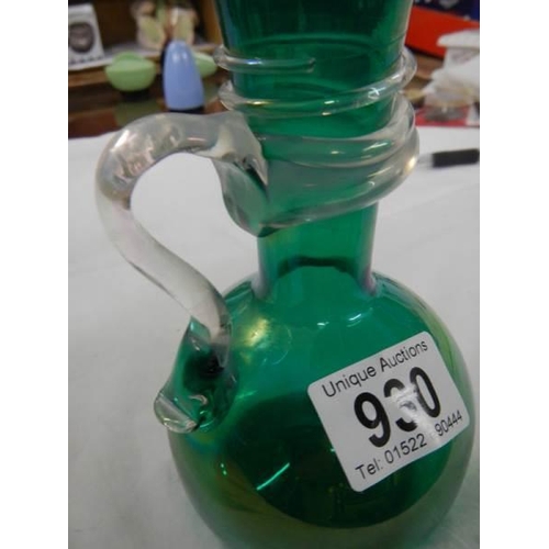 930 - An early 20th century irridescent green glass vase with wrap around handle.