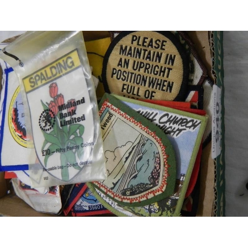 940 - A quantity of vintage cloth tourist badges.