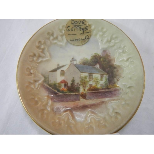 943 - A small early Royal Worcester 'Dove Cottage Grasmere' hand painted plate, 8.25 cm diameter.