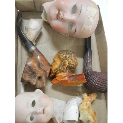 944 - A quantity of vintage pipes, bisque porcelain dolls heads etc.,