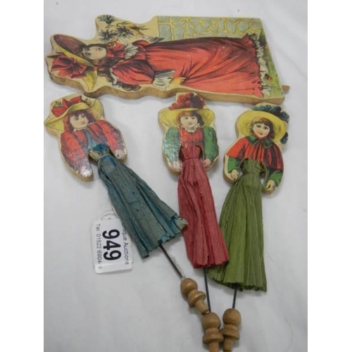 949 - A quantity of Edwardian wooden figure with crepe dresses.