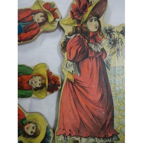 949 - A quantity of Edwardian wooden figure with crepe dresses.