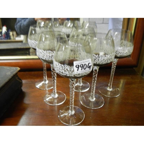 990G - A set of six twist stem wine glasses.