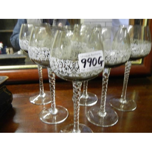 990G - A set of six twist stem wine glasses.