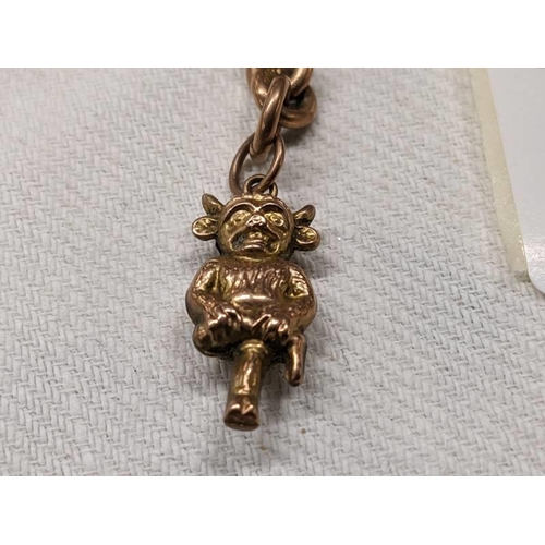 1002 - A 9ct gold Lincoln Imp charm on a 9ct gold 'T' bar. 6.4 grams.