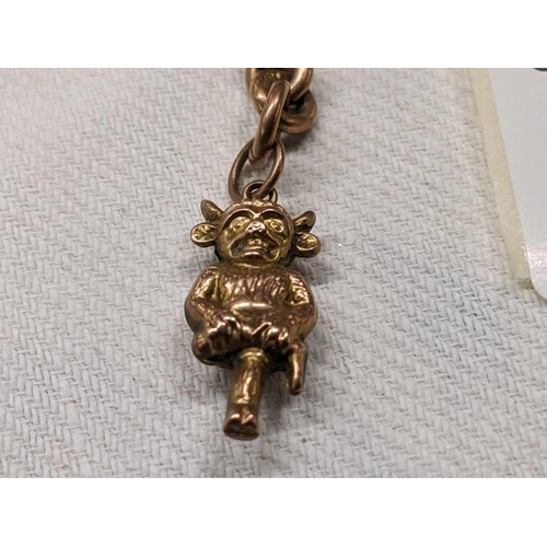 1002 - A 9ct gold Lincoln Imp charm on a 9ct gold 'T' bar. 6.4 grams.