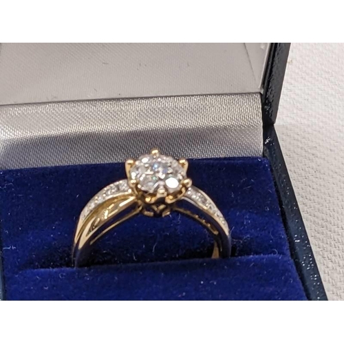 1009 - A 9ct gold ring set CZ?, size P, 3.2 grams.