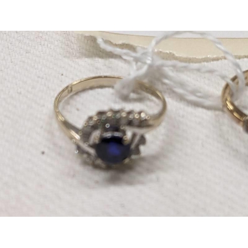 1012 - An 18ct gold blue/white stone cluster ring and a blue and white stone wishbone ring, sizes l & V, 5 ... 