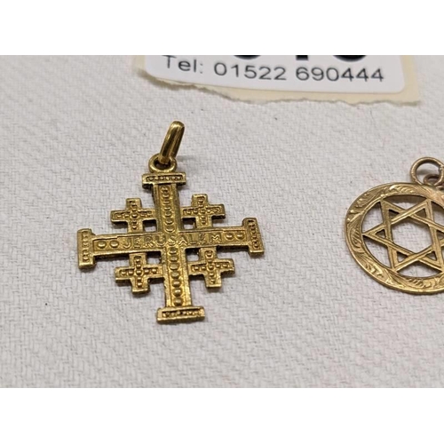 1016 - A 14ct gold cross pendant, 1.8 grams and a 9ct gold Star of David, 1 gram.