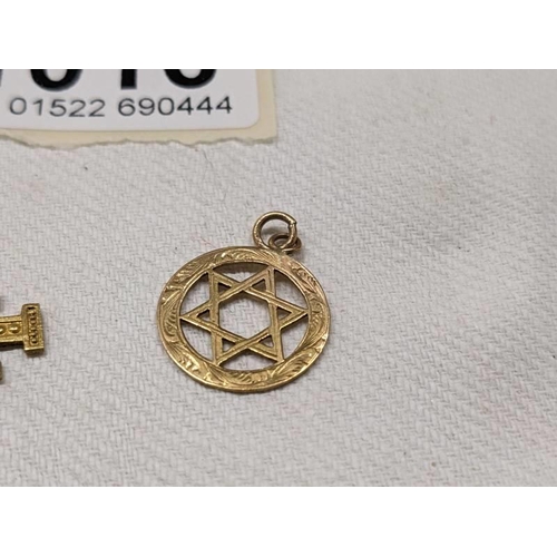 1016 - A 14ct gold cross pendant, 1.8 grams and a 9ct gold Star of David, 1 gram.