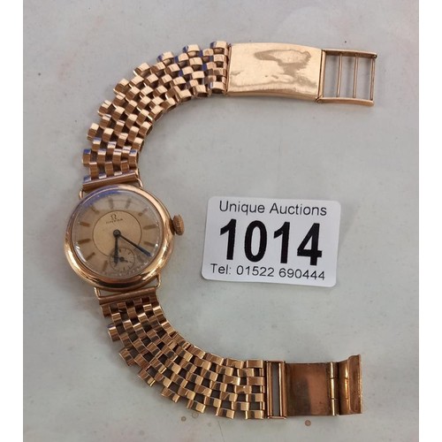 1014 - A 9ct gold Omega wrist watch on a 9ct gold bracelet, in working order, total weight 49.4 grams.