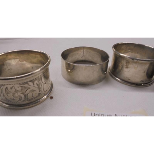 1038 - Five assorted silver napkin rings, 76 grams.