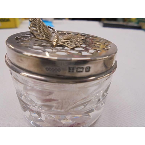 1039 - A hall marked silver trinket box with coat of arms 'S.S.Ormuz' 38 grams and a glass silver topped tr... 