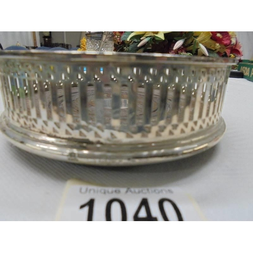 1040 - A hall marked silver wine bottle coaster with mahogany base.