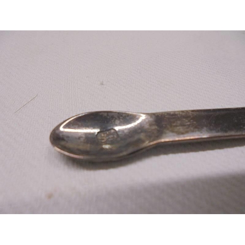 1041 - A glass hair pot with silver top and a pair of hall marked silver sugar tongs.