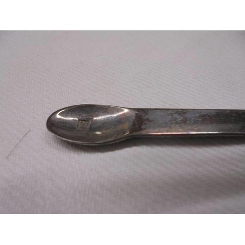 1041 - A glass hair pot with silver top and a pair of hall marked silver sugar tongs.