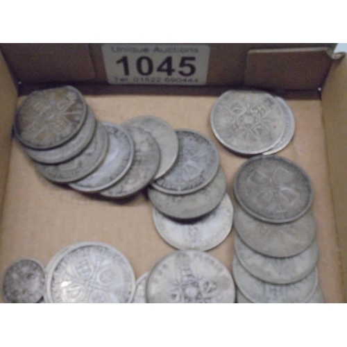 1045 - Approximately 390 grams of pre 1947 silver florins and threepenny bits.