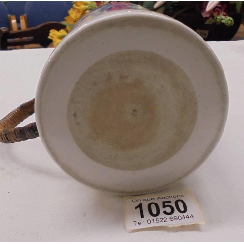 1050 - An early 20th century blue and white tankard with cane handle (a/f chips to top rim).